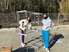 Volunteers helping to set-up the closets that are given to villagers when they first move in