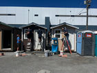 West Monroe volunteers putting various finishing touches on the tiny houses at the Hope Factory